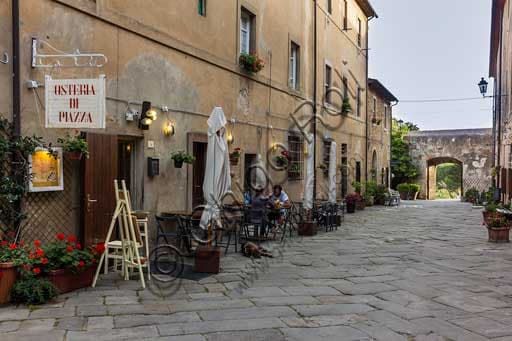 Inside or outside view of the traditional Tuscan osteria on Populonia's main street