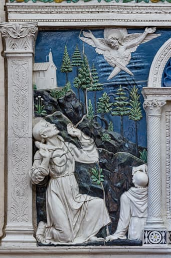 Detail of the altar dossal by Andrea della Robbia in the Basilica of Santa Croce, Florence: bas-relief of St. Francis and St. Bartholomew in glazed polychrome terracotta.