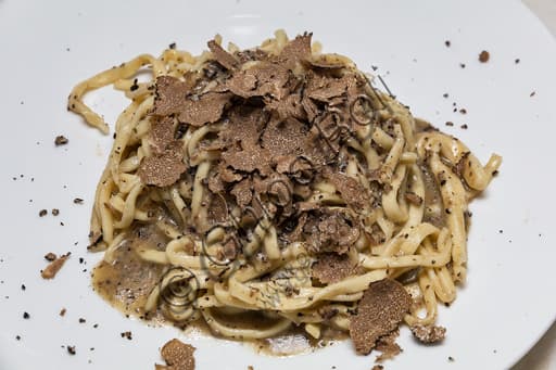 Plate of traditional "Strangozzi" pasta with black truffle at Antica Trattoria Pallotta in Assisi
