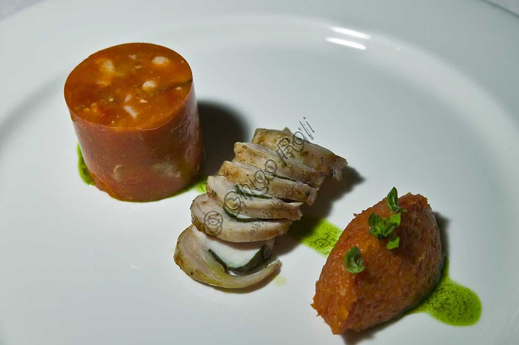 Slice of roast beef on a plate, garnished with a clear, red tomato jelly.