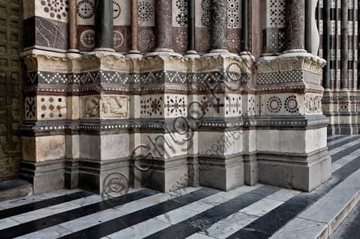Architectural detail of the sculptural bases of the left doorway, St. Lawrence Cathedral, Genoa