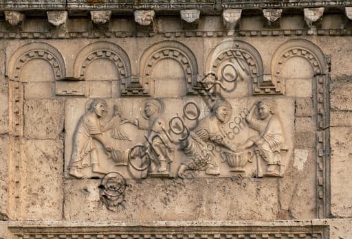 Romanesque bas-relief Christ washing St Peter's feet, façade St Peter's Church Spoleto