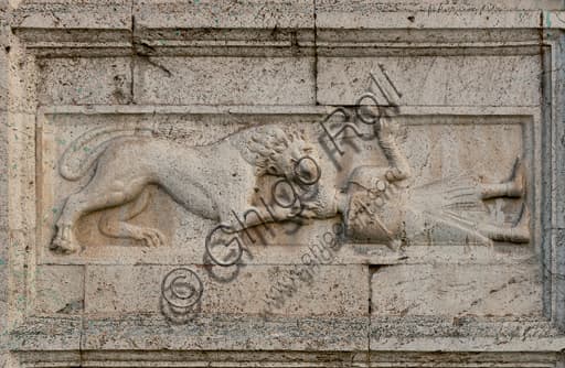 Romanesque bas-relief depicting a warrior attacked by a lion, detail façade St. Peter's Church Spoleto