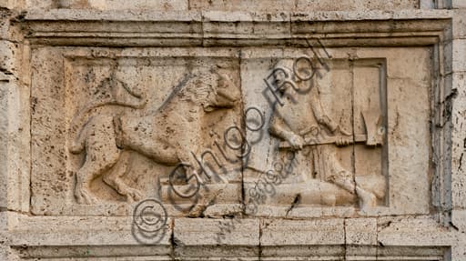 Detail of 12th-century Romanesque bas-relief: man defending himself from a lion, St. Peter's Church Spoleto Italy