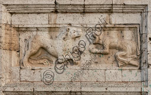 Romanesque bas-relief man begging lion façade St Peter's Church Spoleto