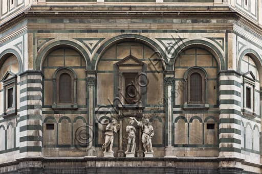 Eastern façade of the Baptistery of St. John in Florence: detail of The Baptism of Christ in white and green Carrara and Prato marble, by Andrea Sansovino.