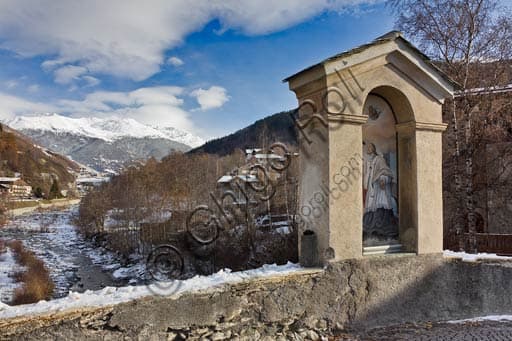 Panoramic view of the Frodolfo creek flowing under the Combo bridge in Bormio, Italian Alps