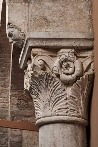 Corinthian capital with sculpted facial detail, Ghirlandina Tower Modena, Campionese Masters
