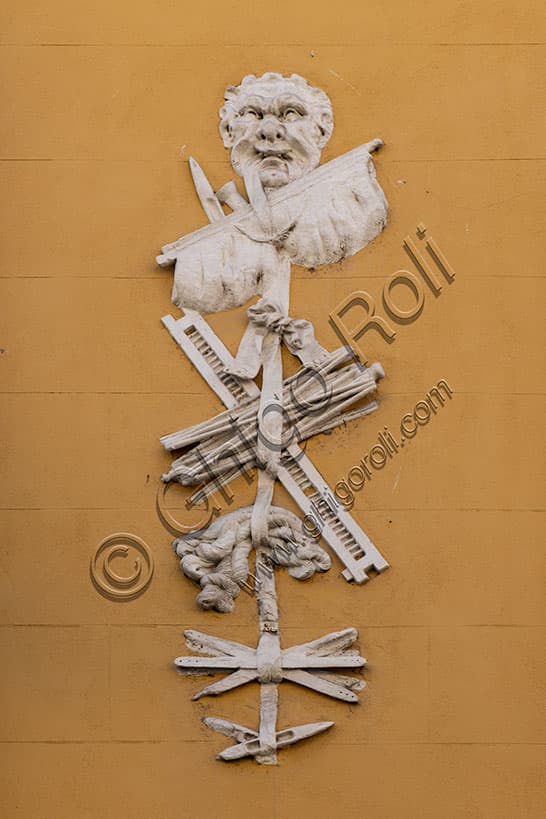 Architectural decoration with silkmaking instruments on the facade of Gastaldi House in Vicenza, Italy