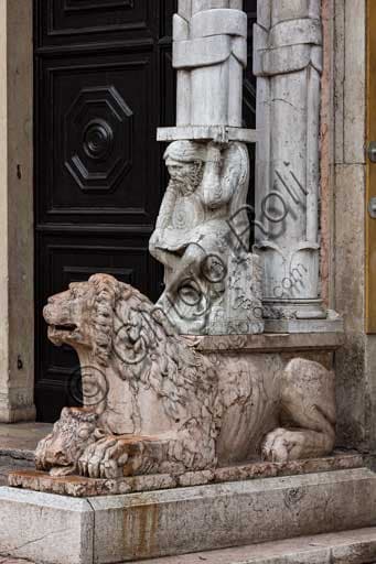 Sculptural detail with lion and telamon supporting the prothyrum of Ferrara Cathedral
