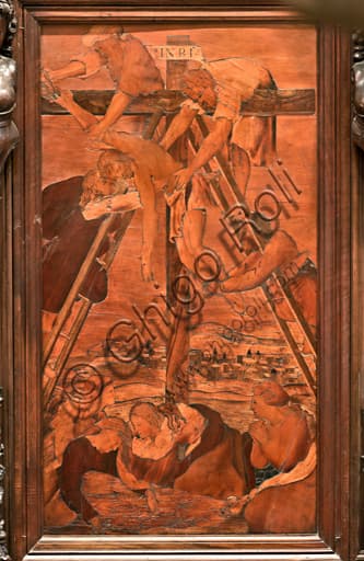 The Deposition, wood intarsia by Gian Michele De' Pantaleoni, choir of Genoa Cathedral (St. Lawrence)