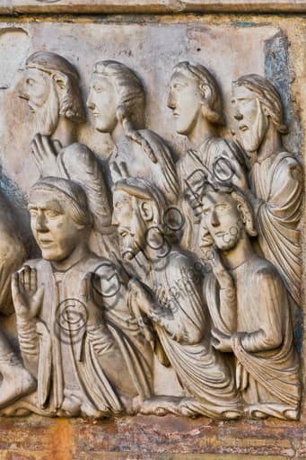 Sculptural detail St Lawrence Martyrdom lunette, bystanders, Genoa Cathedral Italy, 1225
