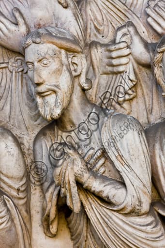 Sculptural detail Martyrdom of St Lawrence lunette, Genoa Cathedral, observing figure, 1225