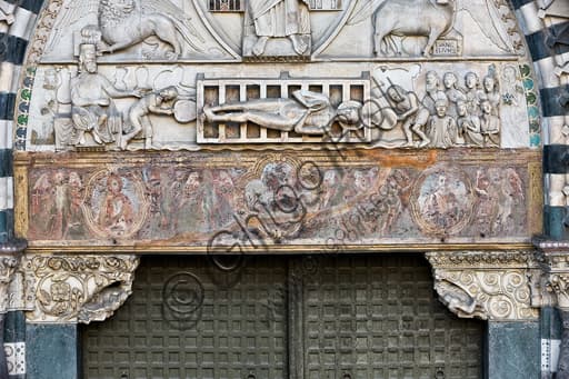 Sculptural detail of the lunette with The Martyrdom of St. Lawrence, Genoa Cathedral (Duomo), west façade, 13th century.