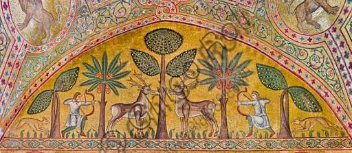 Detail of Byzantine mosaics in the King Roger Room in Palermo: hunting scenes with archers, deer, dogs and banana and palm trees.