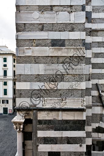 Detail of the south side of Genoa Cathedral (St. Lawrence) showing the fronts of ancient Roman sarcophagi embedded in the wall