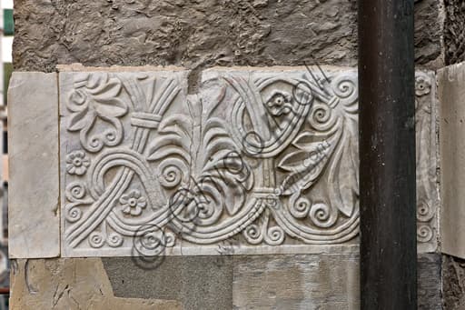 Sculptural detail of the panel with Romanesque floral motifs, south side of St. Lawrence Cathedral in Genoa