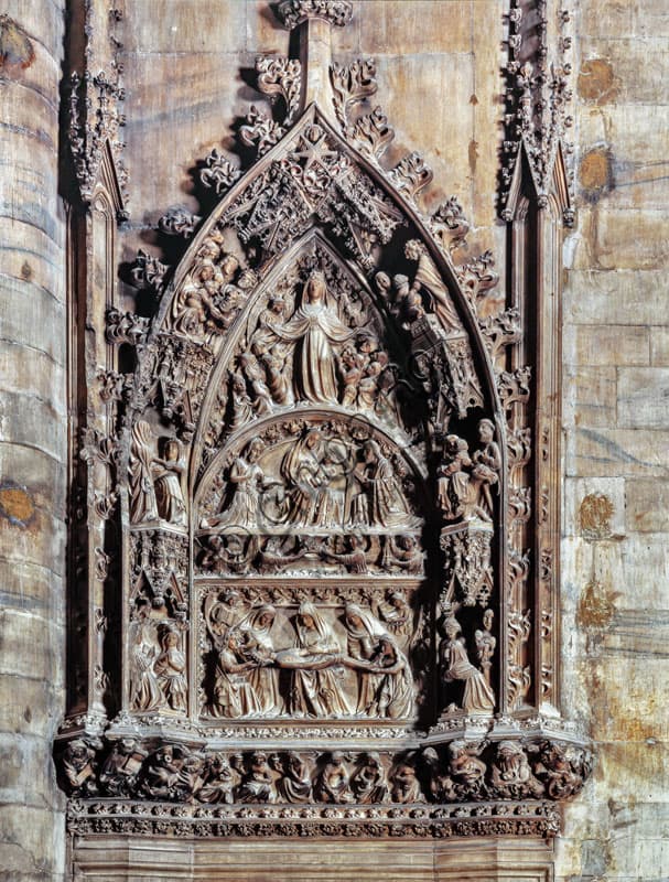 Late Gothic sculptural portal of Milan Cathedral's South Sacristy with scenes of the Assumption and the life of Christ
