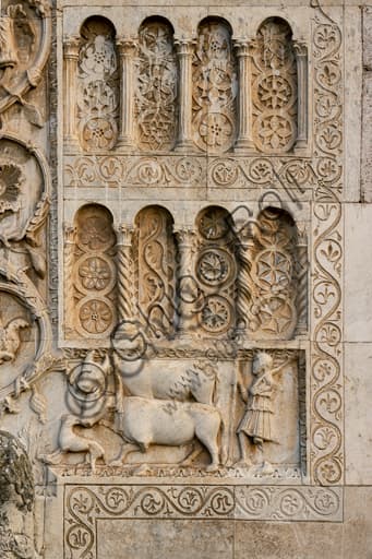 Detail of Romanesque arches St. Peter's Church Spoleto with columns, flowers and stylized animals