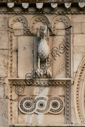 Sculptural detail of the eagle and Cosmatesque decorations on the Romanesque façade of St. Peter's Church, Spoleto.