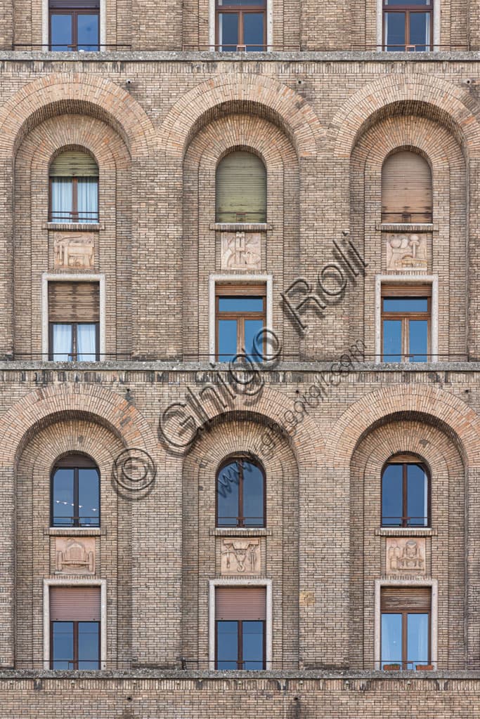 Detail of the rationalist façade of the Torrione INA, Italy's first skyscraper in Piazza della Vittoria, Brescia