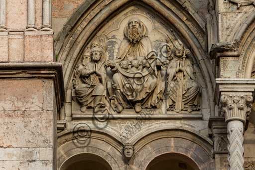 Sculptural detail of the Lunette of the Chosen on the Romanesque façade of Ferrara Cathedral dedicated to St. George