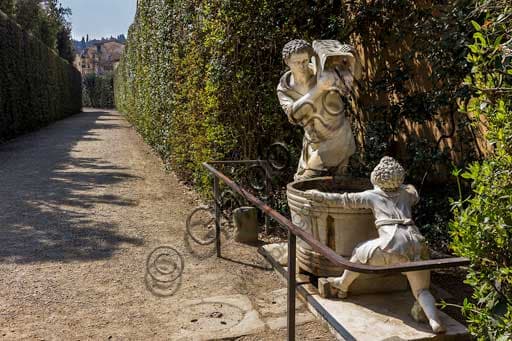 Marble fountain with grape harvest statue in Boboli Gardens, Florence, Italy