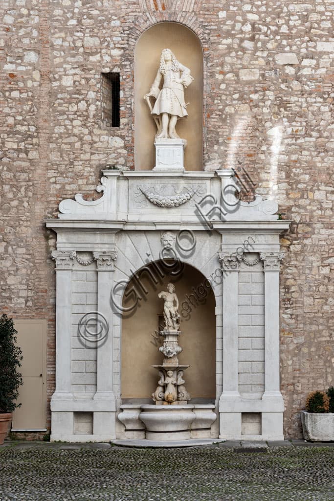Monumental fountain with statue of Neptune in the courtyard of Palazzo Martinengo Cesaresco Novarino, Brescia