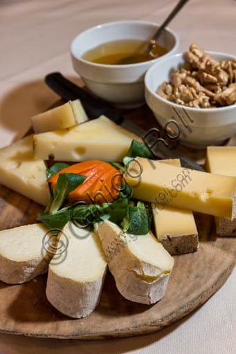 Platter of Valtellina cheeses served with honey and walnuts