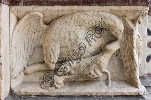 Sculpted panel depicting an eagle clutching its prey, decoration of the left doorway of Genoa Cathedral