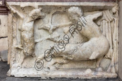 Sculpted panel depicting a centaur shooting a prey, detail of the base decoration of the left doorway, Genoa Cathedral (St. Lawrence Cathedral).