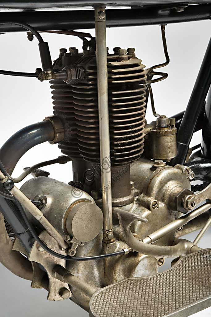 Restored 1926 Garelli Turismo 350 engine, two-stroke with single-block split-cylinder design, detail of the bronze cylinder head.