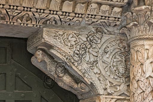 Romanesque sculpture eagle symbol St. John the Evangelist, corbel St. Gotthard doorway, Genoa Cathedral