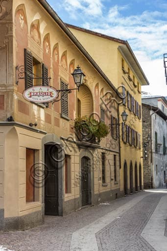 Vintage sign for Braulio bitter on a street in the old town centre of Bormio, in the Italian Alps