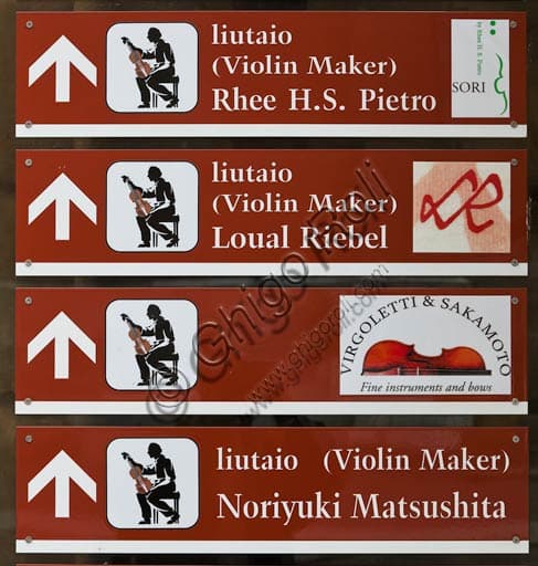 Photo of a luthier's sign in Cremona historic centre, representing Italian violin making tradition