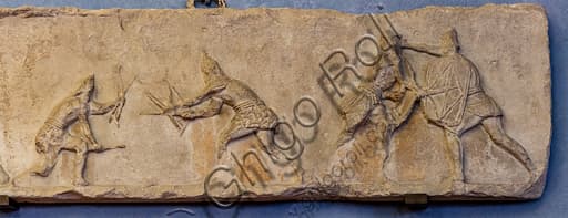 Ancient Roman sculptural slab with relief of sagittarii archers in combat, museum artifact