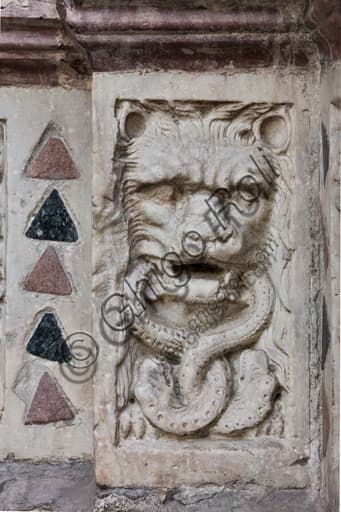 Lion devouring serpents stone relief, main doorway Genoa Cathedral, Master of the Ark of the Baptist 1225