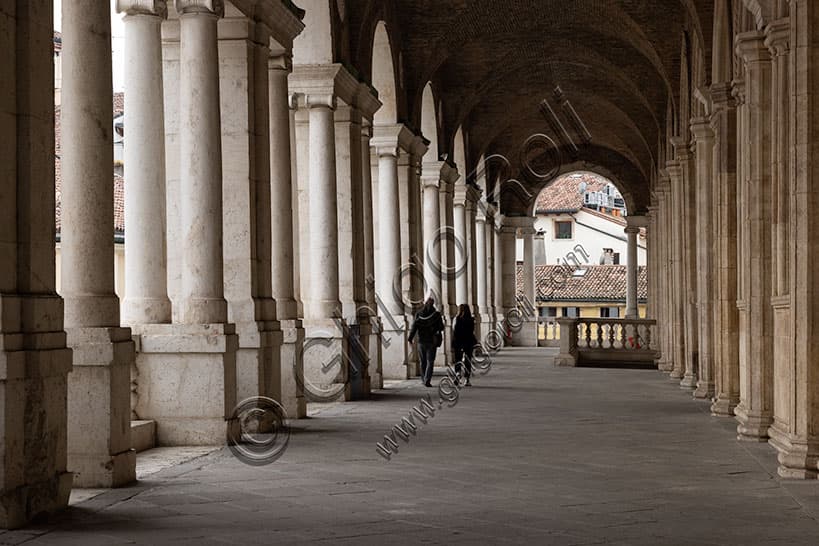View of the first-floor loggia, north side of the Palladian Basilica in Vicenza Italy, overlooking Delle Erbe Square