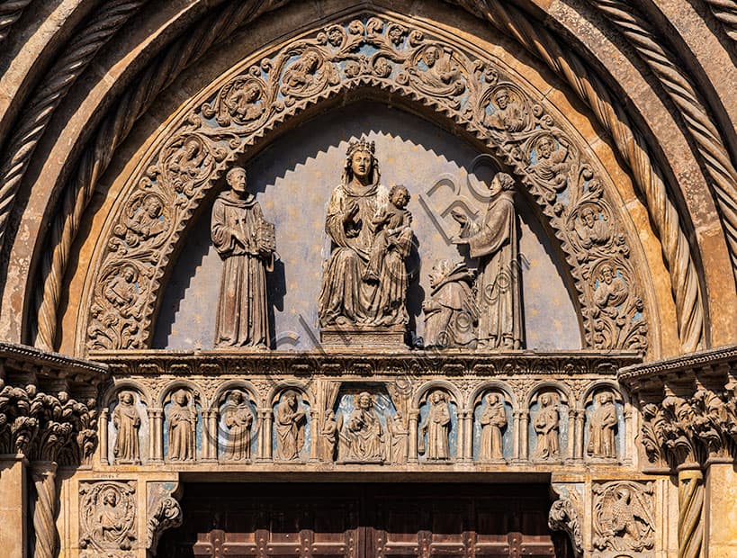 Portal lunette of St. Lawrence Church in Vicenza: Enthroned Madonna with Child, St. Francis and St. Lawrence