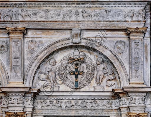 Lunette with the cardinal's heraldic coat of arms of the Piccolomini family, detail of the marble façade of the Piccolomini Library in Siena Cathedral.