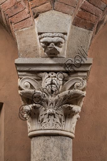 Detail of Corinthian capital with sculpted face, Torresani Hall, Ghirlandina Tower Modena