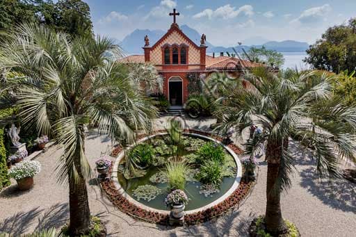Chapel and garden with water lilies pool and palm trees at the Borromeo Palace, Isola Madre, Borromean Islands