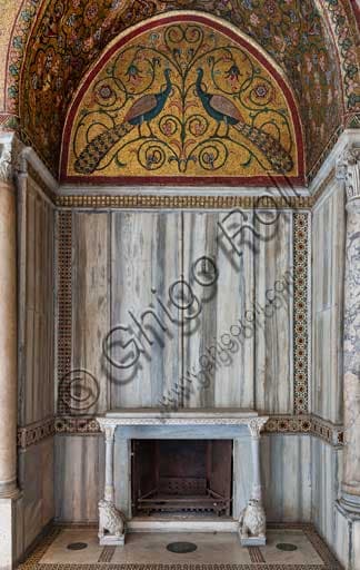 Architectural detail of the Royal Palace of Palermo: fireplace niche with supporting lion sculptures and lunette mosaic with peacocks in the King Roger Room.
