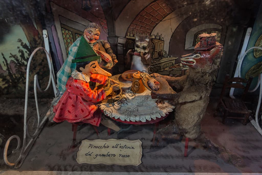 Scena meccanica del Teatro del Parco di Pinocchio: Pinocchio con il Gatto e la Volpe all'Osteria del Gambero Rosso