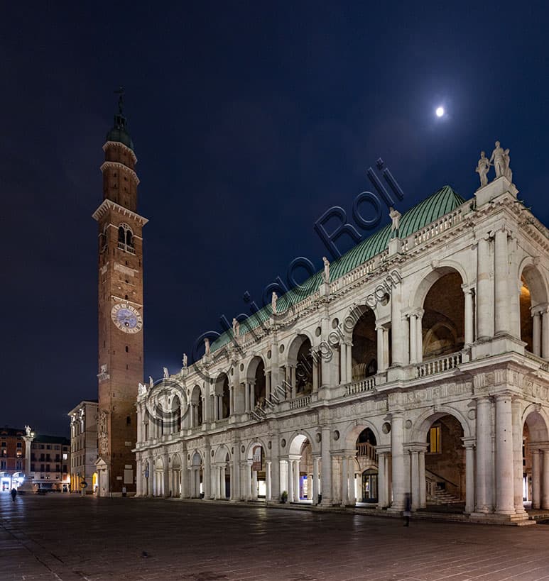 Night view of Piazza dei Signori in Vicenza with the illuminated Palladian Basilica and Bissara Tower