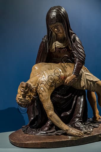 Walnut wood sculpture Lamentation Vecchietta 1445 detail crushed serpent
