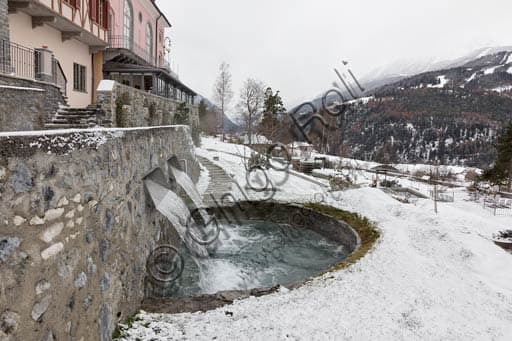 View of the outdoor thermal pools at the Bagni Nuovi spa establishment in Bormio, Italy