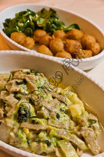 Traditional Valtellina pizzoccheri pasta served with sciatt buckwheat croquettes
