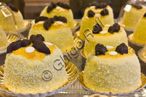 Polenta e Osei, traditional Italian dessert from Bergamo made with sponge cake and creams, presented on a plate