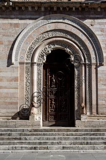 Central sculptural portal of 1201 of the Cathedral of St. Feliciano in Foligno with lunette and cosmatesque mosaics